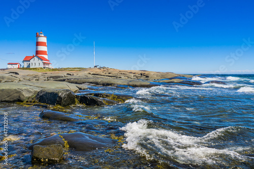 View on the Pointe des Monts lighthouse, the most famous lighthouse of Cote region of Quebec, Canada photo