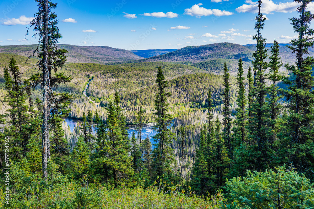 Fototapeta premium View from the top of Montagne de la Solitude, on the forest and the Port Cartier reserve in Cote Nord region of Quebec, Canada