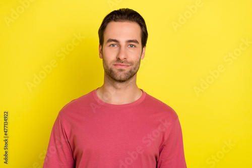 Photo of confident successful bearded guy look camera wear pink t-shirt isolated yellow color background