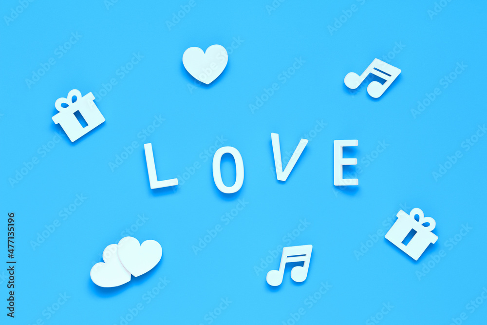 word LOVE, gifts, hearts and music notes on a blue background word LOVE, gifts, hearts and music notes on a blue background