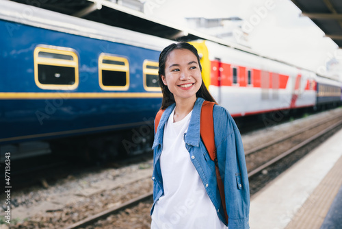 Portrait beautiful woman traveler tourist with bag pack at train station