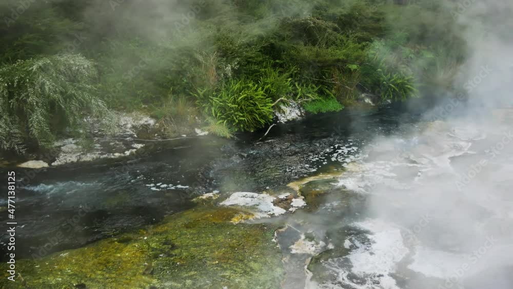 Dense steam of geothermal river rising up to sky - Geothermal minerals in nature of New Zealand Dense steam of geothermal river rising up to sky - Geothermal minerals in nature of New Zealand