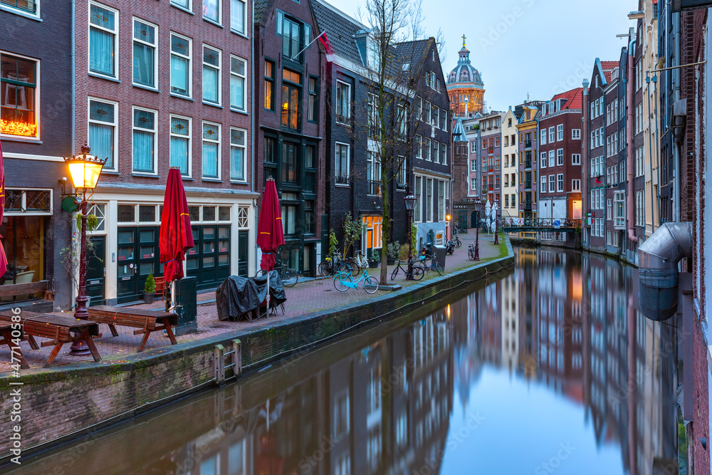 Empty De Wallen, famous red-light district, during morning blue hour, Amsterdam, Holland, Netherlands.