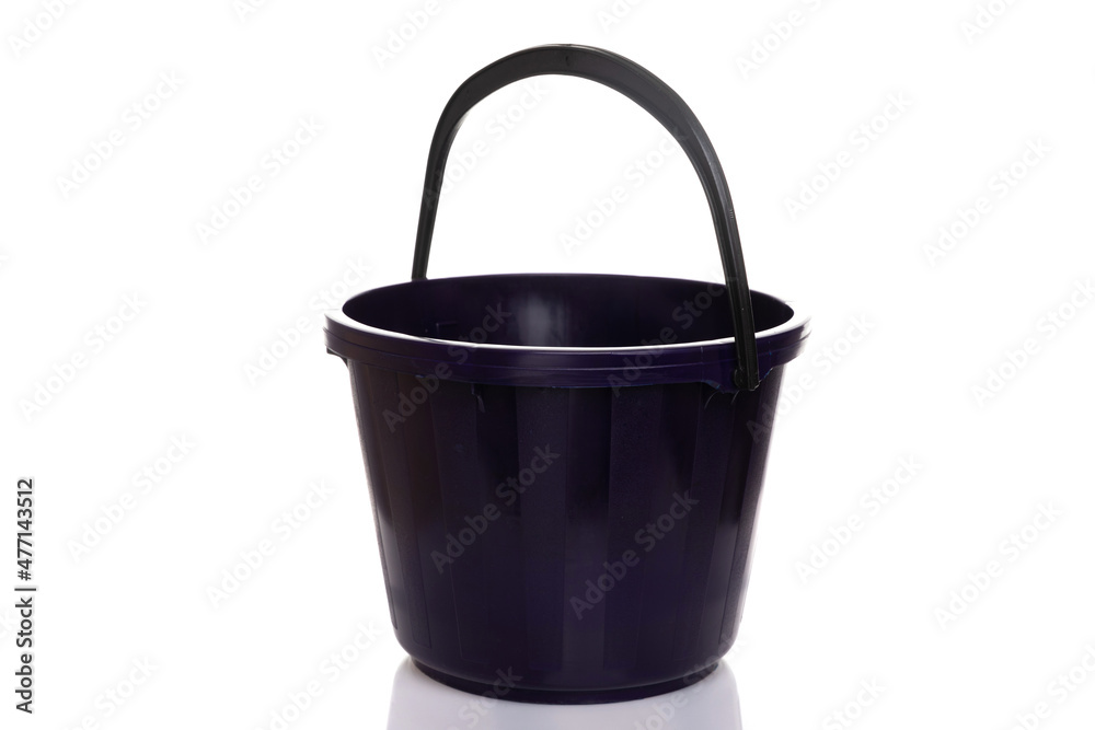 black empty bucket with handle on white plastic background black empty bucket with handle on white plastic background