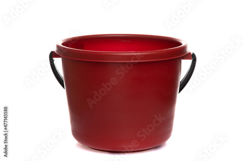 empty plastic burgundy bucket with black handle isolated on white background