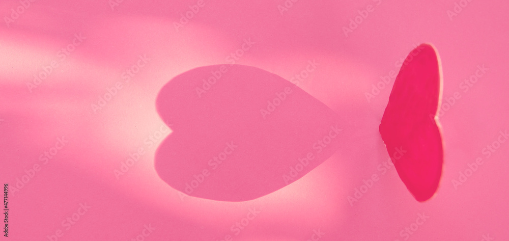 pink heart shape on paper with light and shadow.Good Health, Love, and Valentine's Day