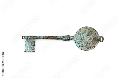 Old rusty door key isolated on white. © Emre