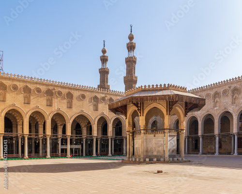 Ablution fountain mediating the courtyard of public historic mosque of Sultan al Muayyad, with background of arched corridors surrounding the courtyard, and minarets of the mosque, Cairo, Egypt © Khaled El-Adawi