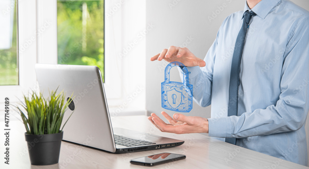 Male hand holding a lock padlock icon.Cyber security network. Internet technology networking.Protecting data personal information on tablet. Data protection privacy concept. GDPR. EU.Banner Male hand holding a lock padlock icon.Cyber security network. Internet technology networking.Protecting data personal information on tablet. Data protection privacy concept. GDPR. EU.Banner