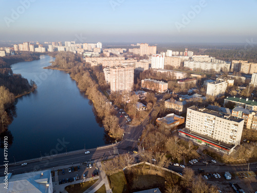 Photography Aerial view of the residential neighborhood and public park on the banks of Pekhorka river