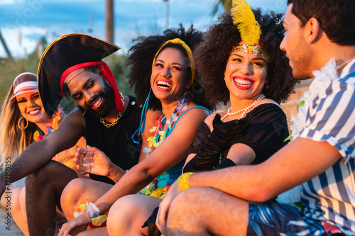 Carnaval Party in Brazil, brazilian young people having fun at fest event in costume.