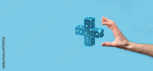 Businessman hand holding 3D plus low polygonal icon.Plus sign virtual means to offer positive thing like benefits, personal development, social network Profit,health insurance, growth concepts.