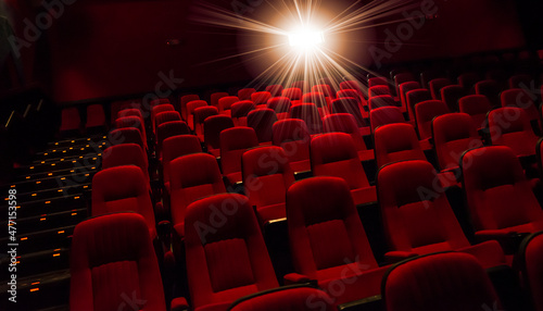 Rows of empty red seats in theater photo