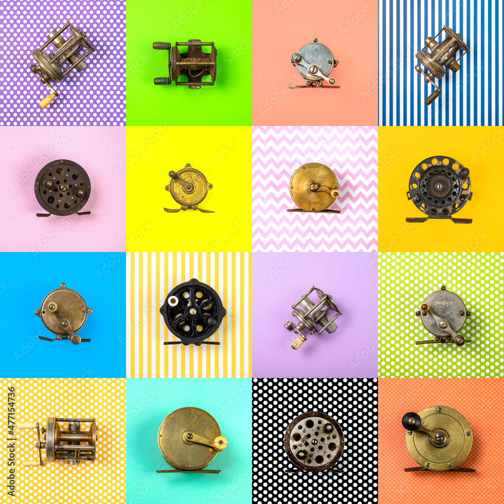 Vintage fishing reels on multi-colored patterned background Stock Photo