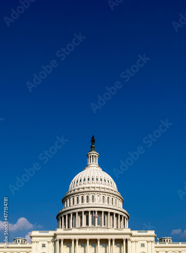 USA, Washington D.C., USA Capital building with flag against blue sky