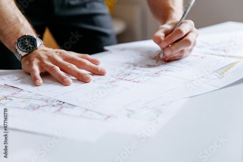 Architect / Project development drawing on floor-plans photo