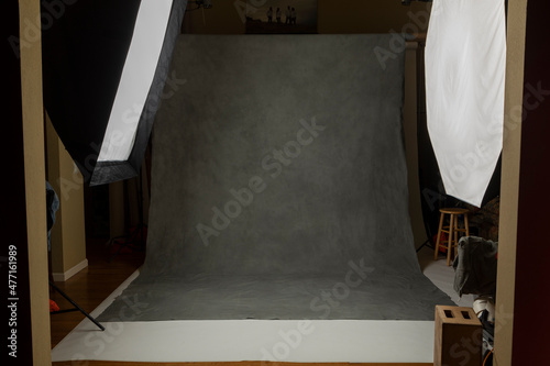 Photo studio set with lightboxes and painted muslin background