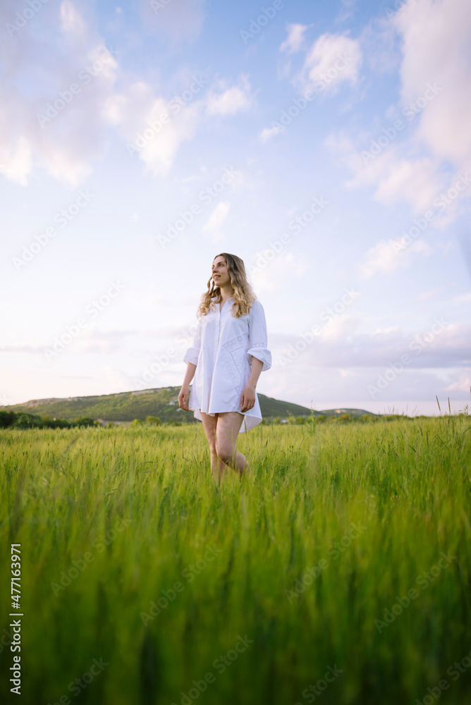 Young woman standing in agricultural field Young woman standing in agricultural field