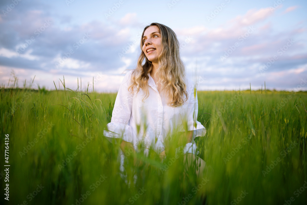Young woman standing in agricultural field Young woman standing in agricultural field