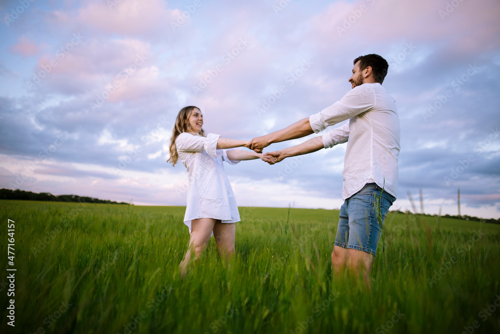 Couple dancing in agricultural field Couple dancing in agricultural field