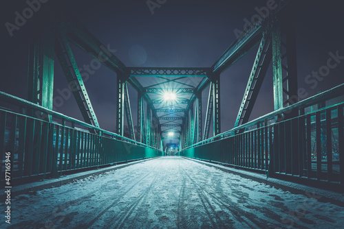 Nowoczesny żelazny most w nocy zimą. Most im. Heleny Sendlerowej w Opolu photo