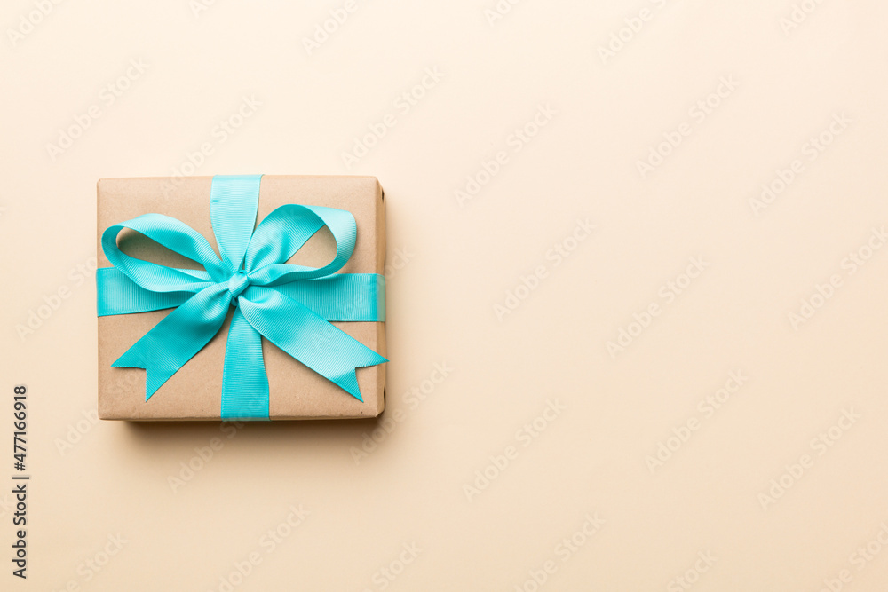 Holiday present box over colored background, top view. Copy space for design Holiday present box over colored background, top view. Copy space for design