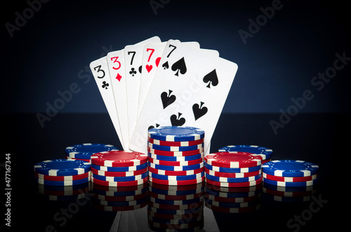 Fotografie Playing cards in poker game with full house or full boat combination