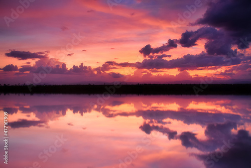 Dramatic sunset over mountain and sea.