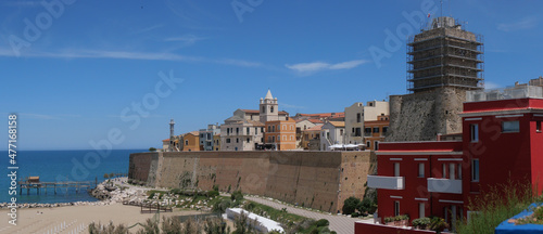 Panorama of the Swabian Castle of Termoli enclosed by the city walls with towers overlooking the Adriatic Sea and on the ancient fishing machine called Trabucco.