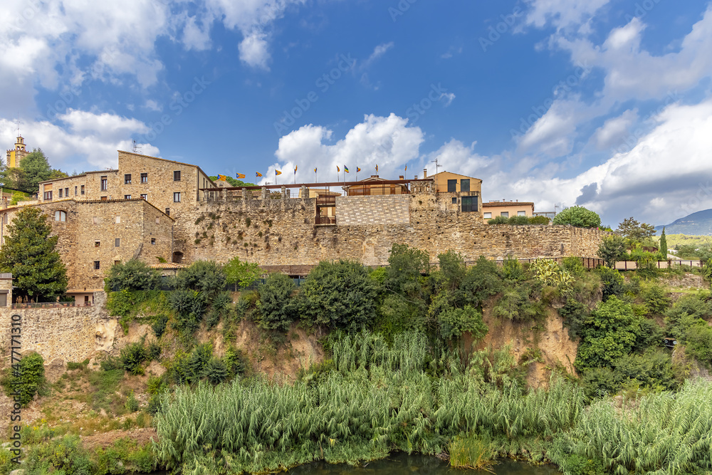 Spain, Besalu, a medieval museum town on the river bank, a fortress wall.
