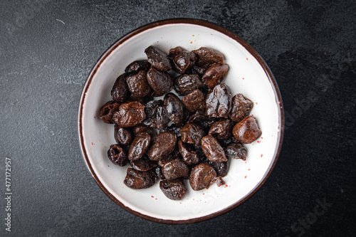 sun-dried olives smoked pitted olive fruit healthy meal food snack on the table copy space food background rustic top view keto or paleo diet veggie vegan or vegetarian food