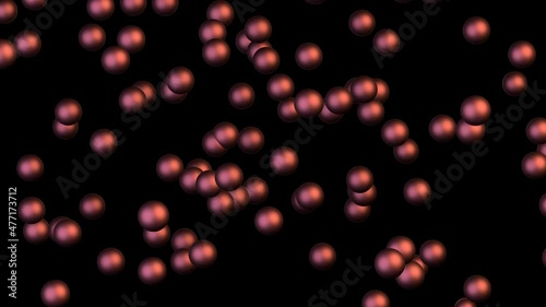 Chaotic Brownian motion of copper balls on a black background. The erratic movement of red balls in the dark.