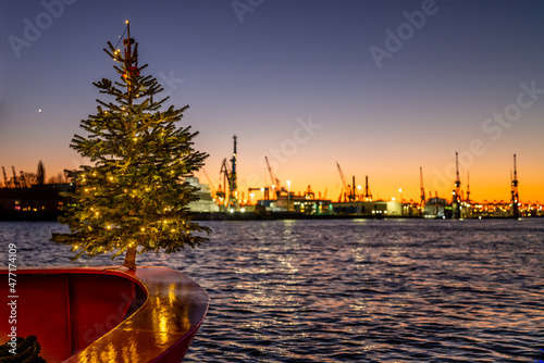 Hamburg, Germany. Christmas tree in the harbor at sundown.