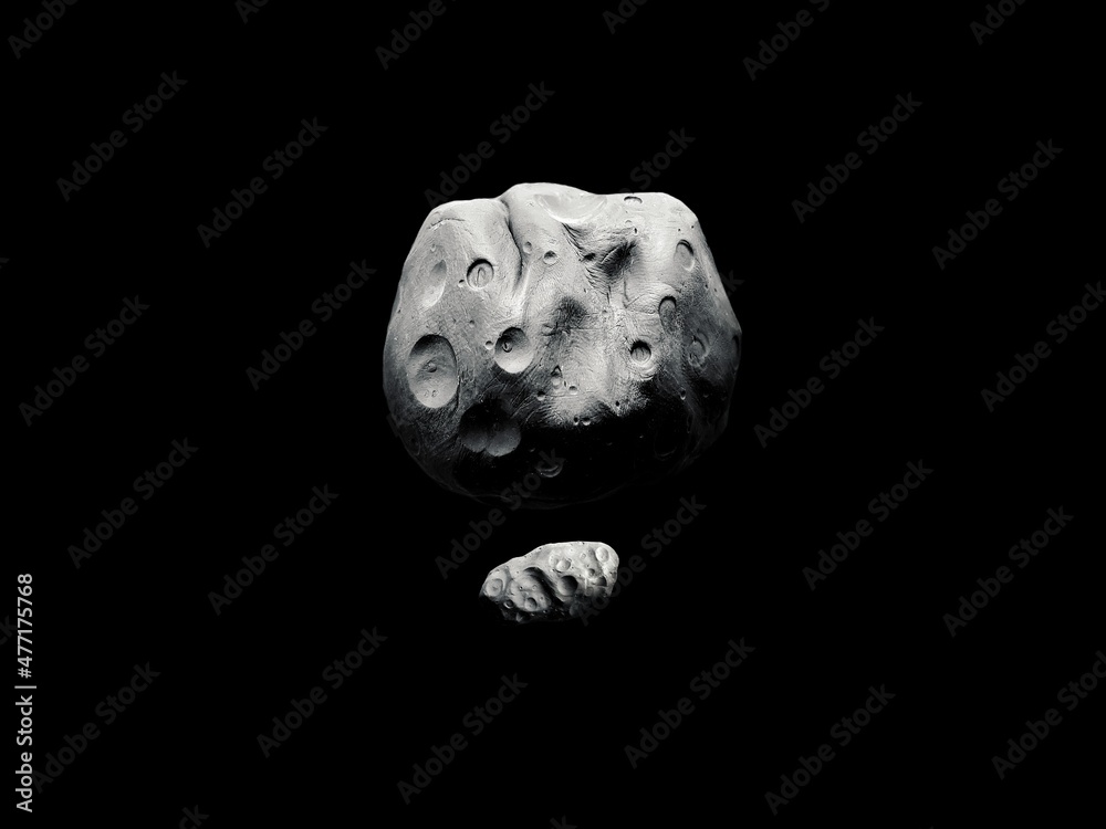 Two large asteroids with craters in space, asteroid with satellite. Celestial body capable of destroying an entire planet.