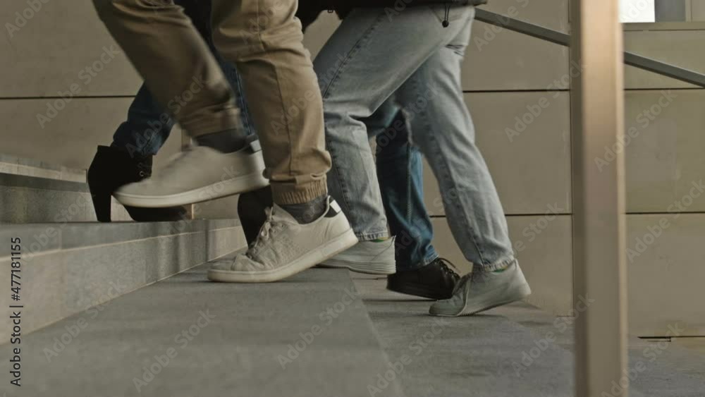 Legs of different people going down the stairs of an underpass or subway. Legs of different people going down the stairs of an underpass or subway.