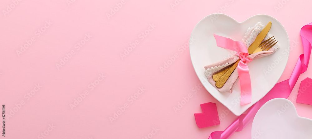 Beautiful table setting for Valentine's Day on pink background with space for text Beautiful table setting for Valentine's Day on pink background with space for text