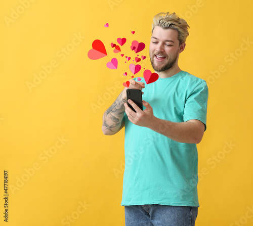 Young man with mobile phone...