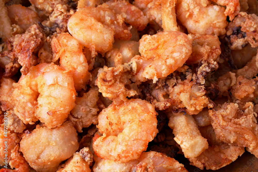 Delicious close-up photo of a fried seafood with shrimp, squid and cuttlefish. Delicious close-up photo of a fried seafood with shrimp, squid and cuttlefish.