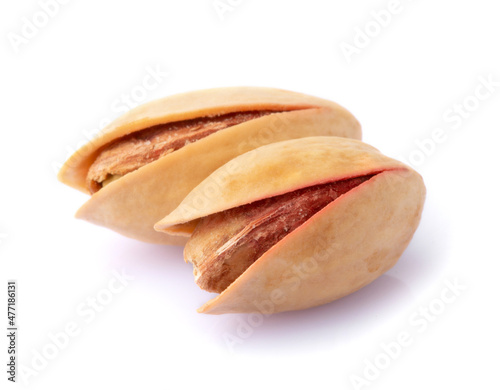 Two pistachios isolated on a white background