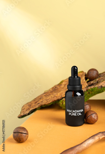 Macadamia essence oil with macadamia nuts. Organic product for cosmetic. Healthy skin, facial and body care. SPA and selfcare wellness, wellbeing concept