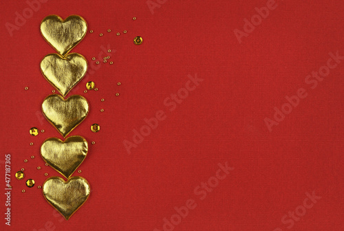 Golden hearts in a border a...