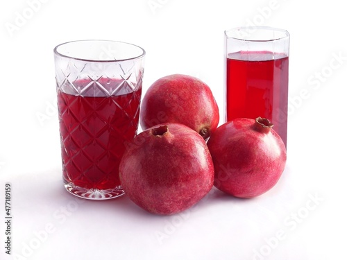 red,juicy pomegranats as vegetarian food and drink