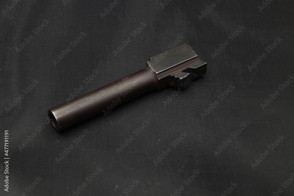 The pistol barrel on black background The pistol barrel on black background