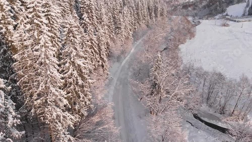 Winter in the mountains. Forest in the snow. Shooting from a quadcopter.