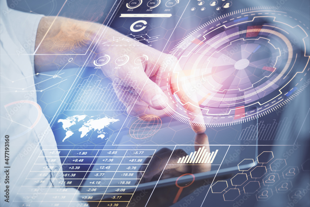 Double exposure of man's hand holding and using a digital device and data theme hologram drawing. Technology concept.