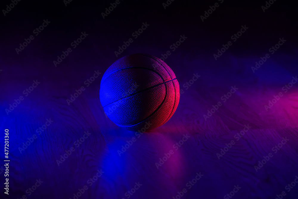 Basketball ball isolated on dark background. Blue neon banner. Horizontal sport theme poster, greeting cards, headers, website and app