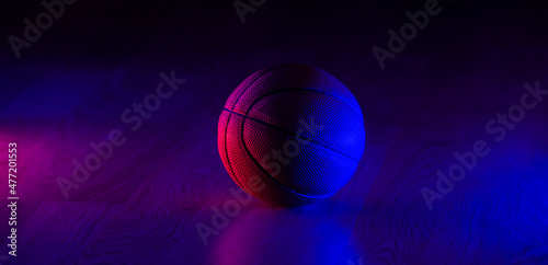 Basketball ball isolated on dark background. Blue neon banner. Horizontal sport theme poster, greeting cards, headers, website and app © Augustas Cetkauskas