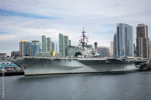 A View of the San Diego, California, Downtown Area from a Boat on Coronado Bay with the City Waterfront Embarcadero and the USS Midway  photo