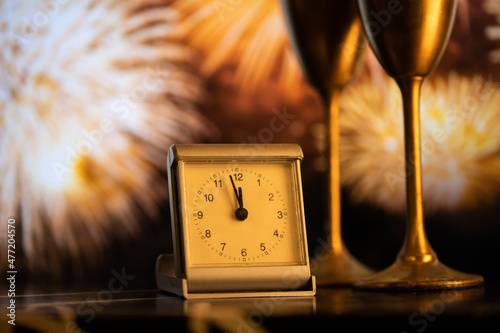 Canvas Print clock at midnight and fireworks  New Year's eve celebration