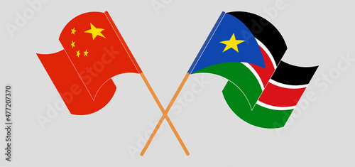 Crossed and waving flags of China and South Sudan
